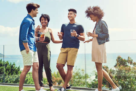 Were so happy to be finally here together. Shot of a group of friends having drinks and enjoying...