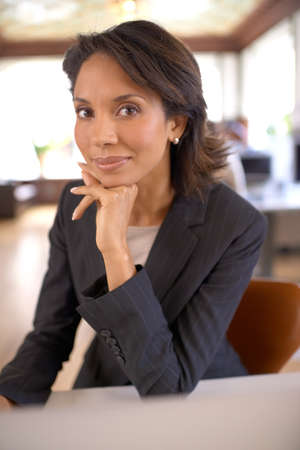 Im in my element when Im at work. Attractive businesswoman feeling satisfied while at work.の写真素材