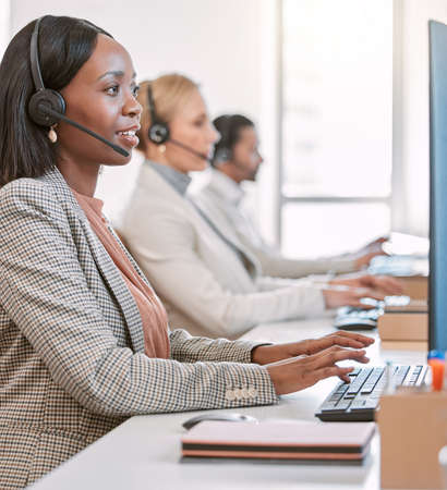 Theyre on call. Cropped shot of an attractive mature female call center agent wearing a headset...