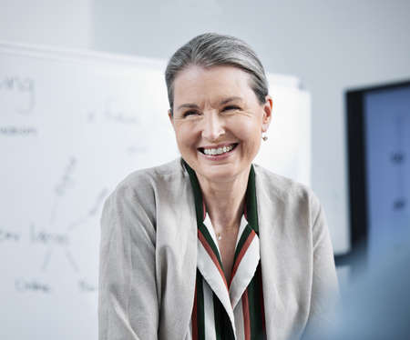 Leading my team to greatness. Shot of a female businesswoman in her office.の写真素材