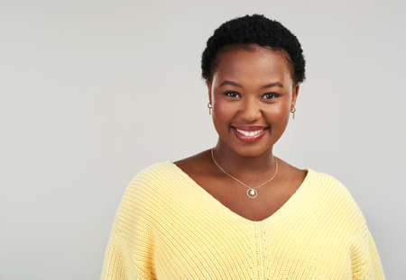 Do you know what I love about you Your smile. Shot of a beautiful young woman smiling while posing...