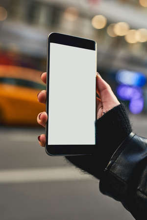 Searching for all the popular places in the city. Cropped shot of an unrecognizable woman using the gps on her cellphone.の写真素材