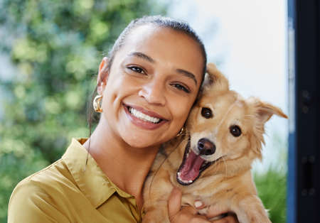 Theyre a womans best friend too. Cropped portrait of an attractive young businesswoman and her...