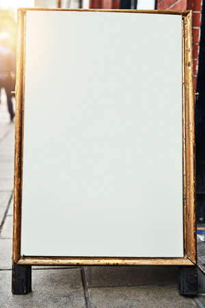 Dont walk pass it without reading it. Shot of a sidewalk sign with space for you to add your own text.の写真素材