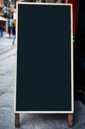 Just enough space for your ad. Shot of a sidewalk sign with space for you to add your own text.の写真素材