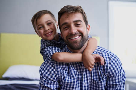I wanna be just like my dad. Cropped portrait of a handsome young man and his son sitting in their home.の写真素材