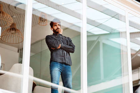 Pondering over his next great achievement. Shot of a young businessman looking thoughtful while...