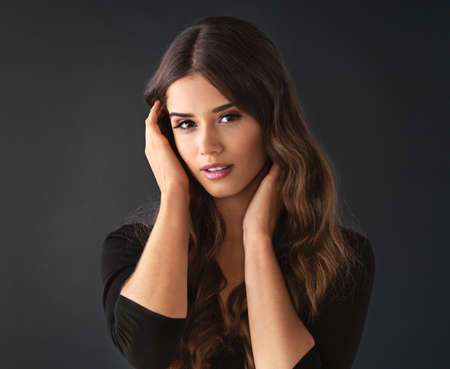 Beauty is not a number. It has no limits. Studio shot of a beautiful young woman against a dark...