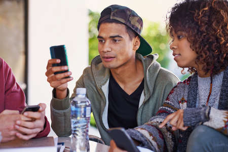 Any idea how this app works. A student using his phone while sitting with friends.