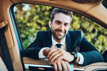 Time to get to the office. Cropped shot of a handsome young corporate businessman.の写真素材