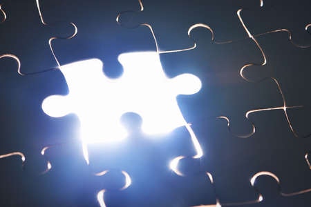 The final piece. Cropped shot of a puzzle missing a single piece.の写真素材