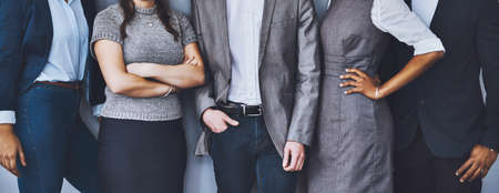 Confident theyre right for the job. Cropped shot of a group of unrecognizable businesspeople waiting in line for their interviews.の写真素材