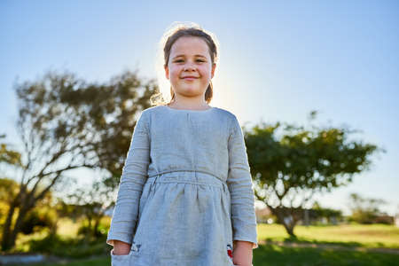 Join me for some fun in the sun. Portrait of a cute little girl enjoying a day at the park.