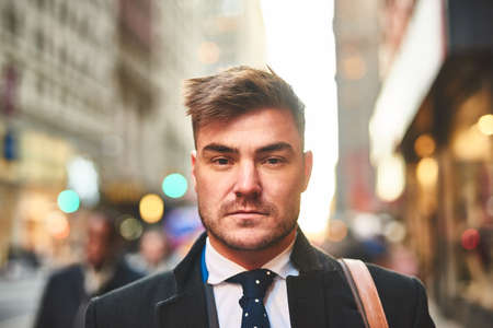 Just another man living in the city. Portrait of a confident young businessman standing in the...