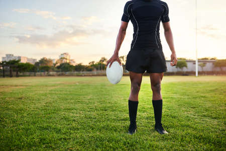 This is my comfort zone. Cropped shot of an unrecognizable sportsman standing alone and holding a...