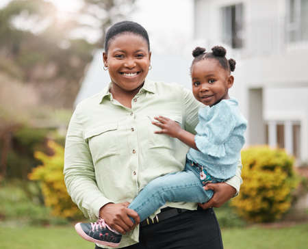 She just wants to be carried like a queen. Portrait of a mother carrying her little daughter while...