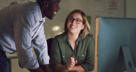 What do you think. Cropped shot of two businesspeople working together on a computer in their...