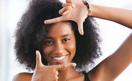 Whats your frame of reference. Portrait of a confident young woman making a finger frame.