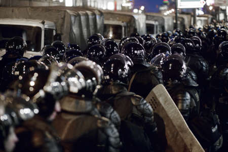 Lets create love not war. The army barricading a riot in the city.の写真素材