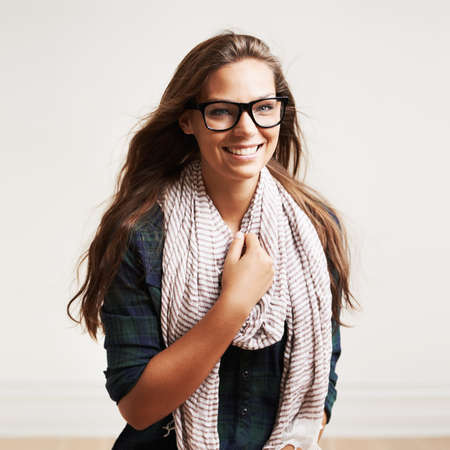 Laughter and relaxation. Shot of a stylish young woman laughing.の写真素材