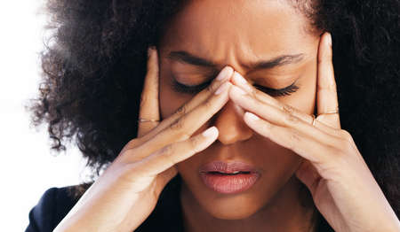 How do I beat this burnout. Shot of a young businesswoman experiencing stress while working in a...