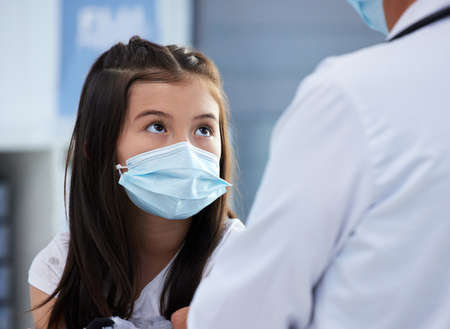 Please tell me its done. Shot of a little girl getting a vaccination by a doctor in a hospital.