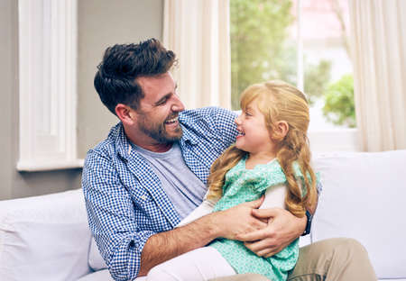 You will always be my precious little girl. Shot of a young father and his daughter bonding at home.