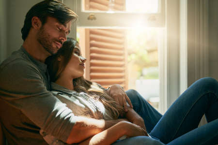 Every moment shared with you feels like an eternity. Shot of an affectionate young couple holding...