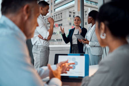 Coming up with ideas that will transcend the market. Shot of a group of businesspeople brainstorming...