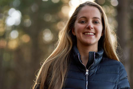 Im happiest when Im outside. Portrait of a happy young woman exploring a forest on her own.