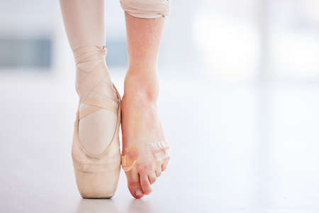 I should definitely tape my feet more often. Cropped shot of a young ballerina wearing a pointe shoe...