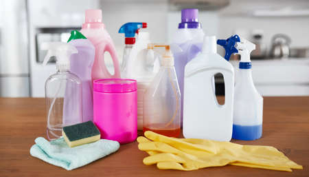 The spring cleaning starter pack. Shot of various cleaning products on a table in the kitchen at...