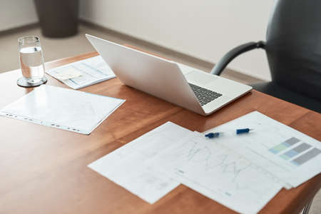 The setup for success. Cropped shot of paperwork and a laptop on a desk in an office.の写真素材