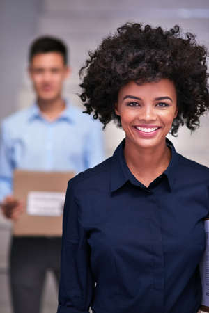 Logistics are our business. Portrait of a happy delivery woman making a delivery to a businessman in...