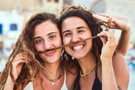 She brings out the fun in me. Cropped shot of girlfriends on vacation.