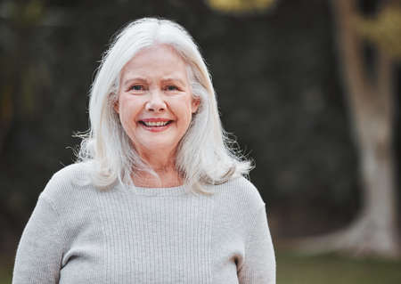 Taking a walk is a breath of fresh air. Shot of a senior woman standing outside.