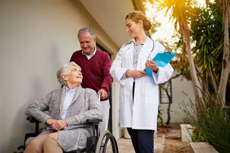 Nothing makes her happier than discharging a healthy patient. Shot of a senior couple and a nurse...