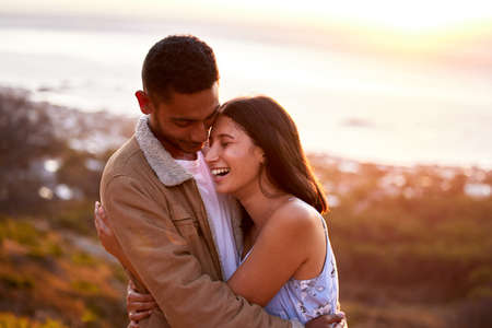 Nowhere else Id rather be. Cropped shot of an affectionate young couple embracing lovingly at...