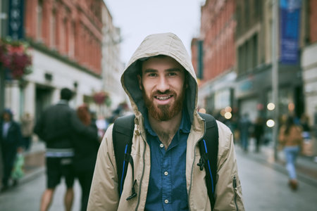My feet will get me to wherever I need to go. Cropped portrait of a handsome young man walking through the city.の写真素材