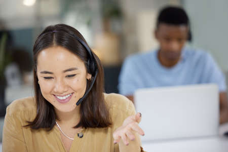 Our operators are well-prepared to handle your inquiries. Shot of a young businesswoman working in a...