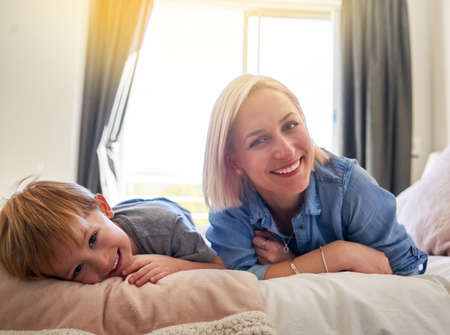 Theyre happiest when theyre together. Portrait of a mother and son spending some quality time together at home.の写真素材