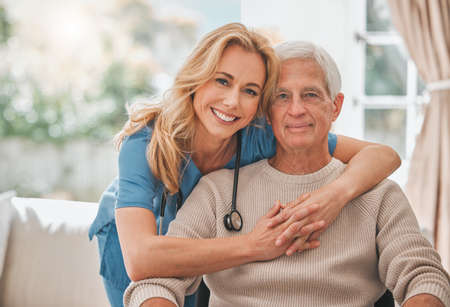 Together well make these years beautiful. Shot of a young nursing home nurse hugging her male...
