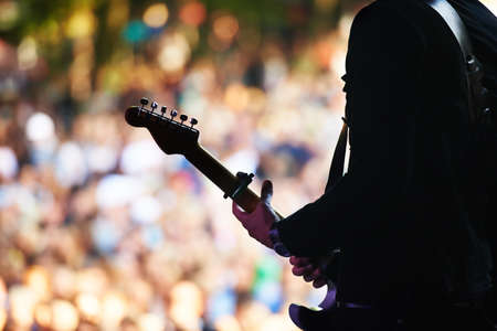 Enjoying the music festival. Cropped shot of a large crowd at a music concert.の写真素材