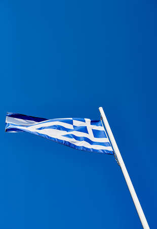 Proudly Greek. Low angle shot of the Greek flag standing on its own outside during the day.の写真素材