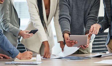 Were always looking for ways to improve. Shot of a group of unrecognizable businesspeople in a...