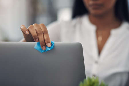 Be sure to disinfect the items you regularly use. Closeup shot of an unrecognisable businesswoman...