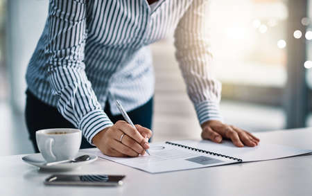 Proper planning is vital for any business. Closeup shot of an unrecognizable businesswoman writing...