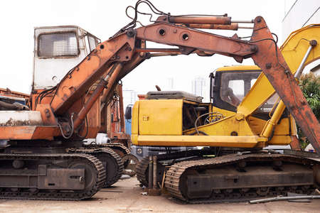 Tough equipment for a rough job. Two bulldozers in a scrapyard.の写真素材