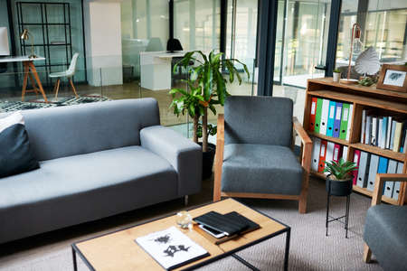 The workplace that puts your wellness first. Shot of a sofa in a therapists consulting room.の写真素材
