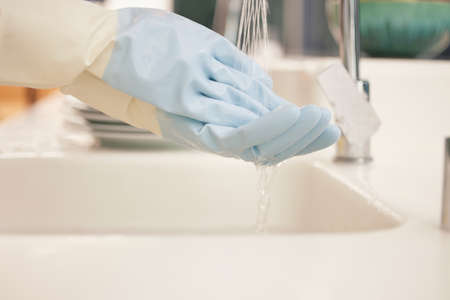 Protecting my hands from dehydration. Shot of a man cleaning his hands underneath running water.